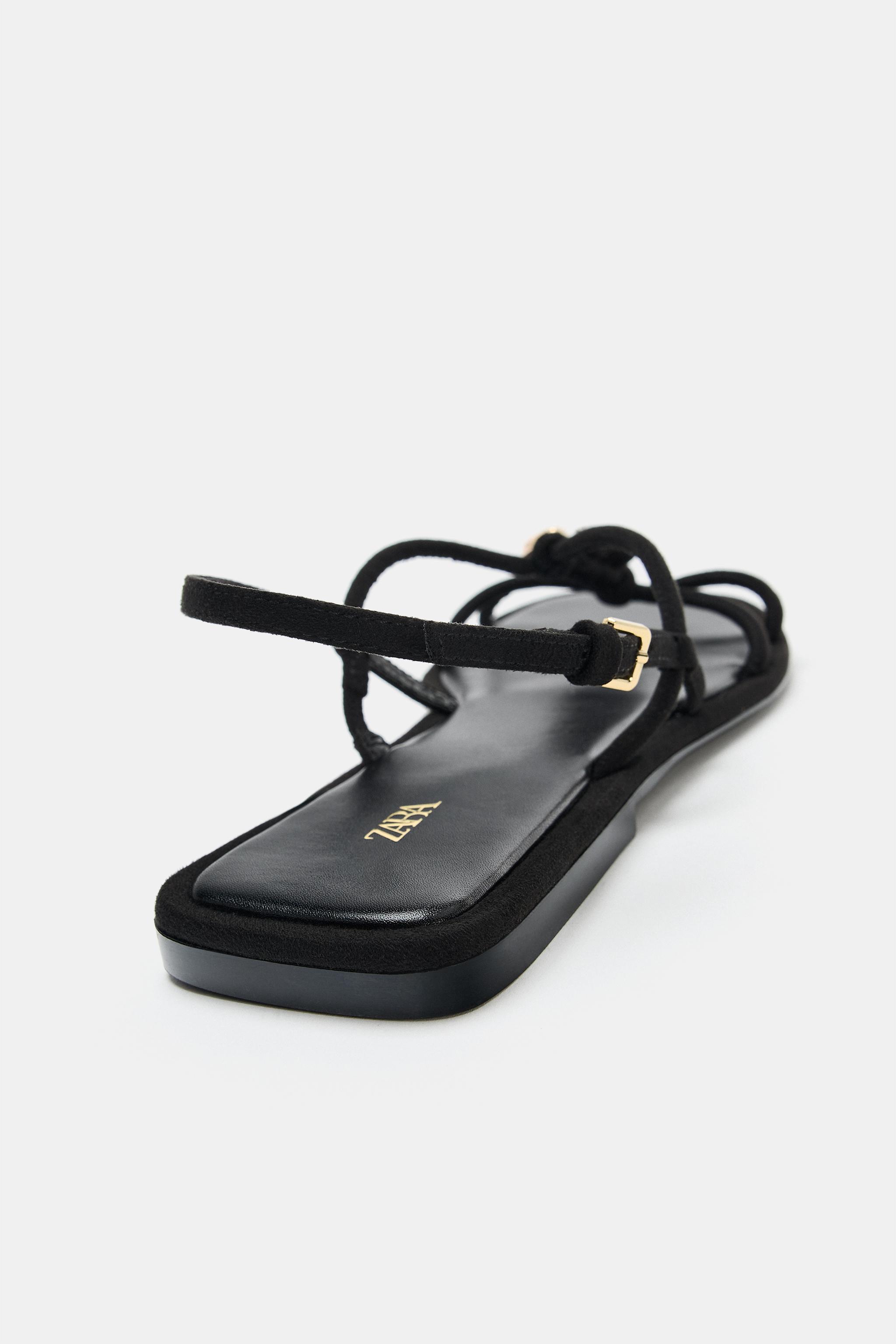 FLAT SANDALS WITH METALLIC APPLIQUÉ